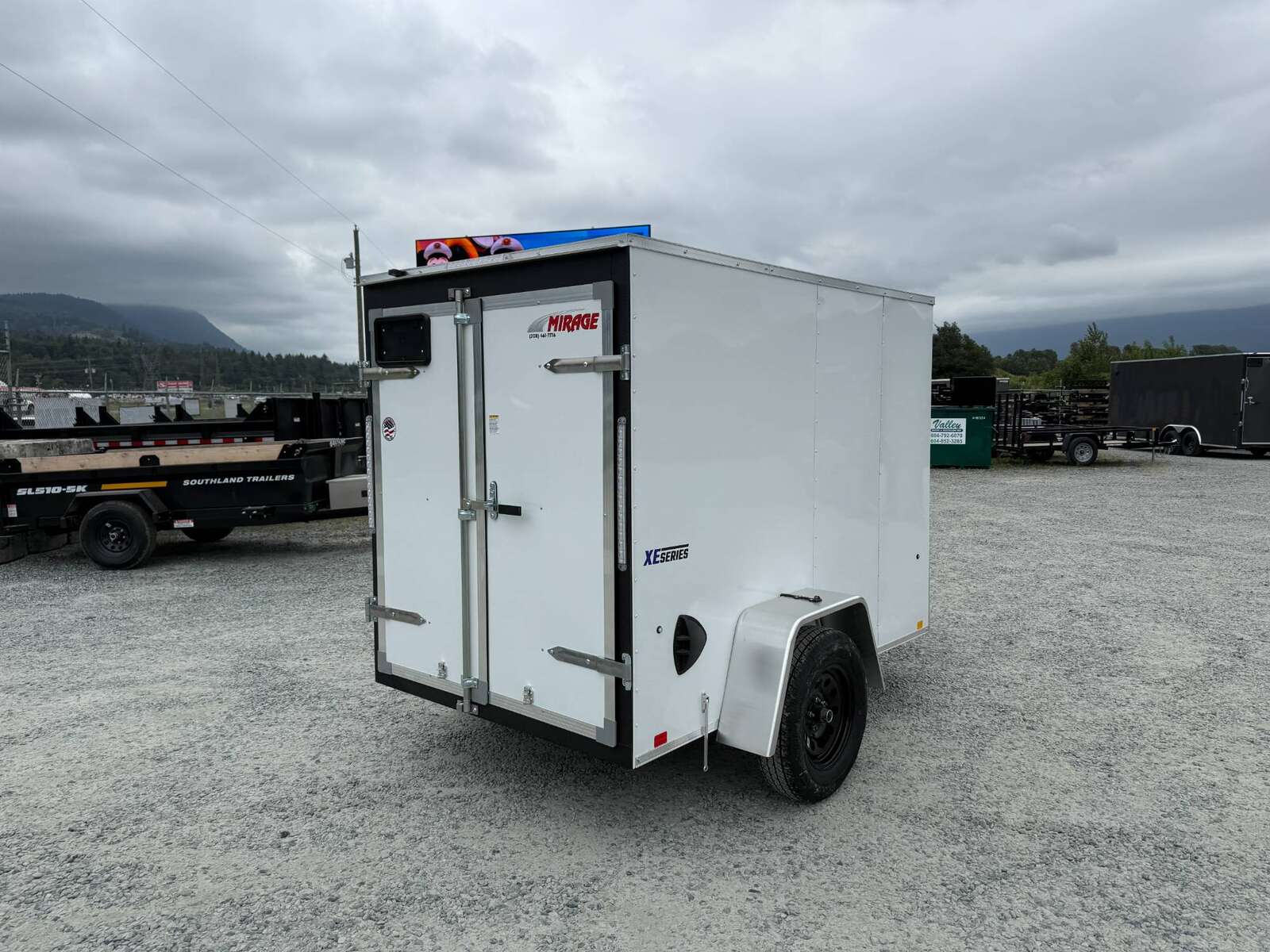 Photo of 2025 Mirage XE 5x8 V Nose Cargo / Enclosed Trailer White Barn Door 2990lb GVW