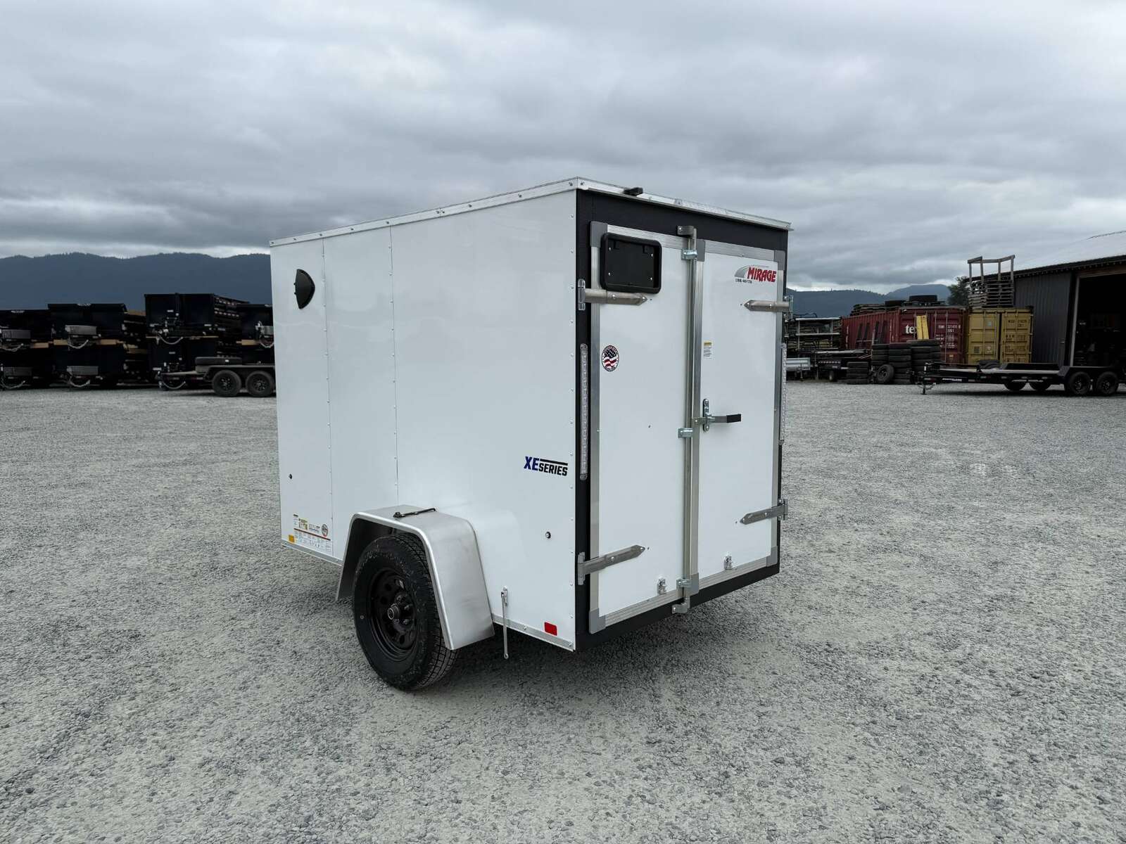Photo of 2025 Mirage XE 5x8 V Nose Cargo / Enclosed Trailer White Barn Door 2990lb GVW