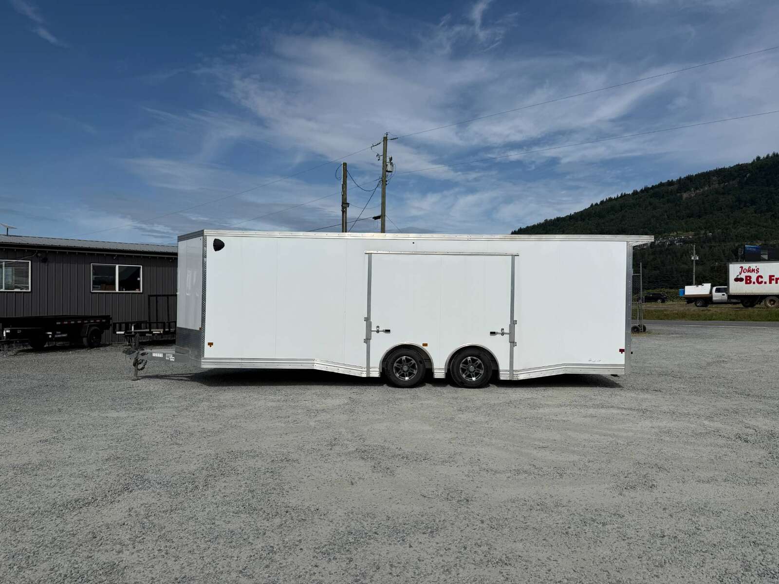 Photo of Pre Owned Used 2022 Alcom Stealth 8.5x24 V Nose Enclosed Cargo Car Hauler Trailer w/ Ramp Door & Elite Side Escape Door & Extended Rear Loading Ramps