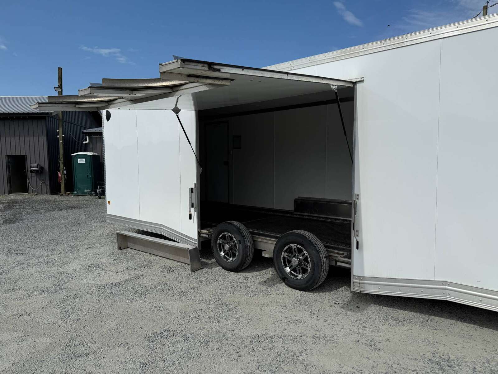 Photo of Pre Owned Used 2022 Alcom Stealth 8.5x24 V Nose Enclosed Cargo Car Hauler Trailer w/ Ramp Door & Elite Side Escape Door & Extended Rear Loading Ramps