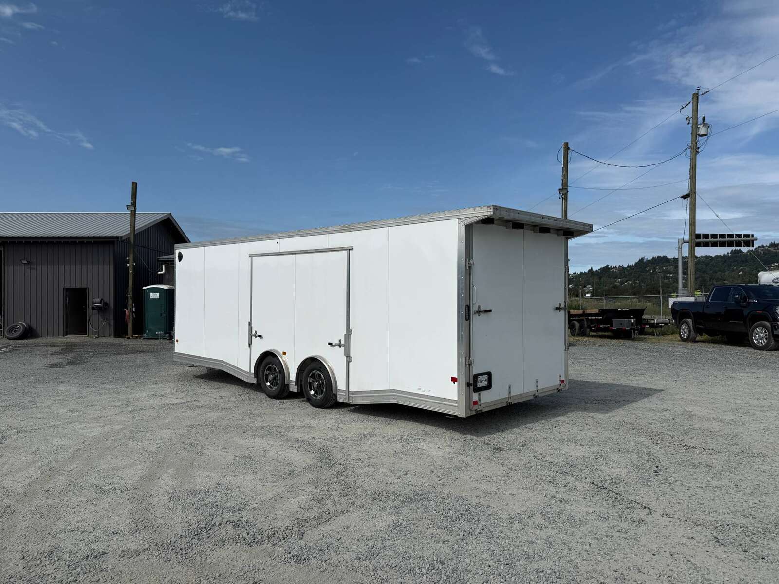 Photo of Pre Owned Used 2022 Alcom Stealth 8.5x24 V Nose Enclosed Cargo Car Hauler Trailer w/ Ramp Door & Elite Side Escape Door & Extended Rear Loading Ramps