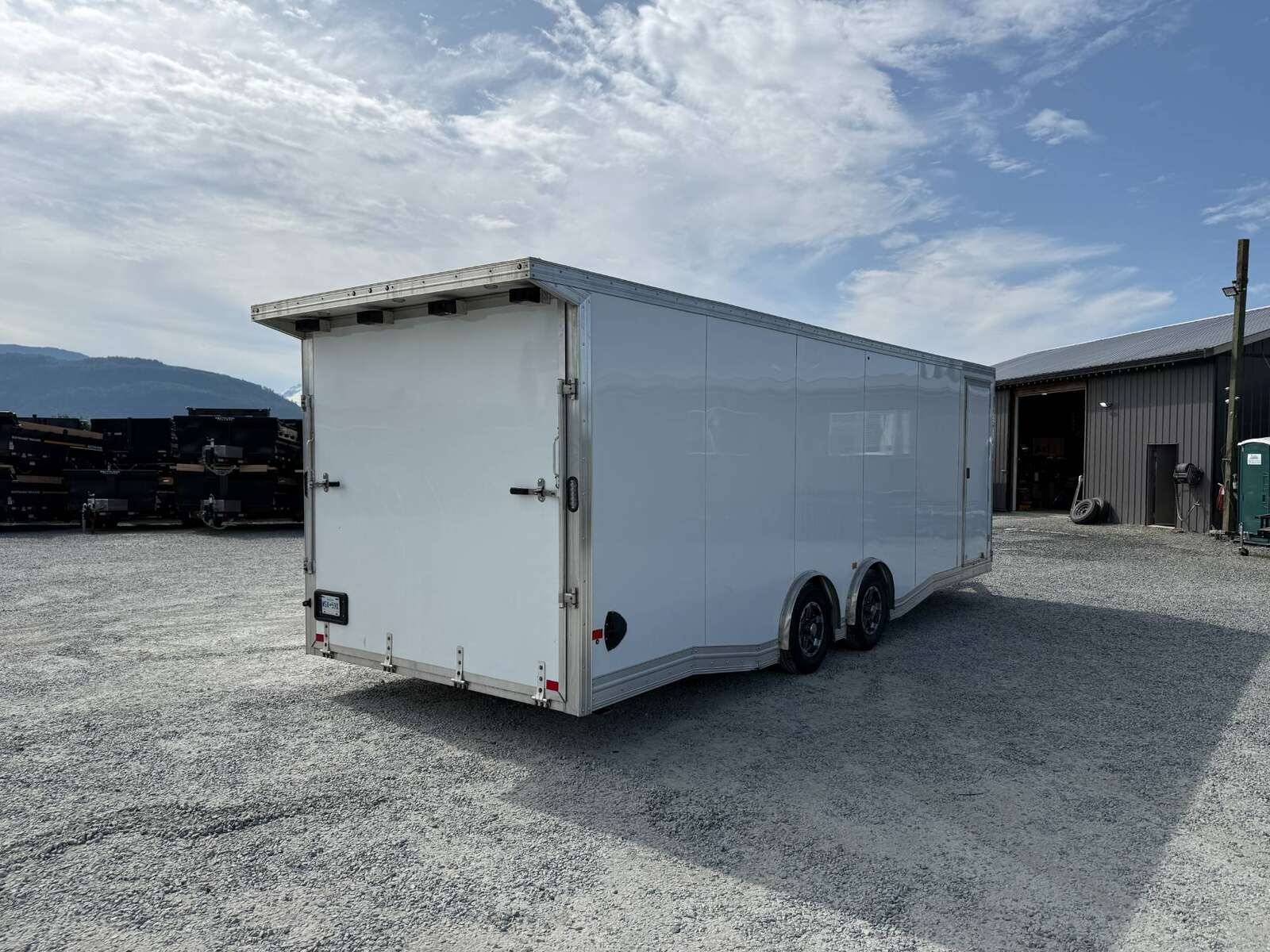 Photo of Pre Owned Used 2022 Alcom Stealth 8.5x24 V Nose Enclosed Cargo Car Hauler Trailer w/ Ramp Door & Elite Side Escape Door & Extended Rear Loading Ramps