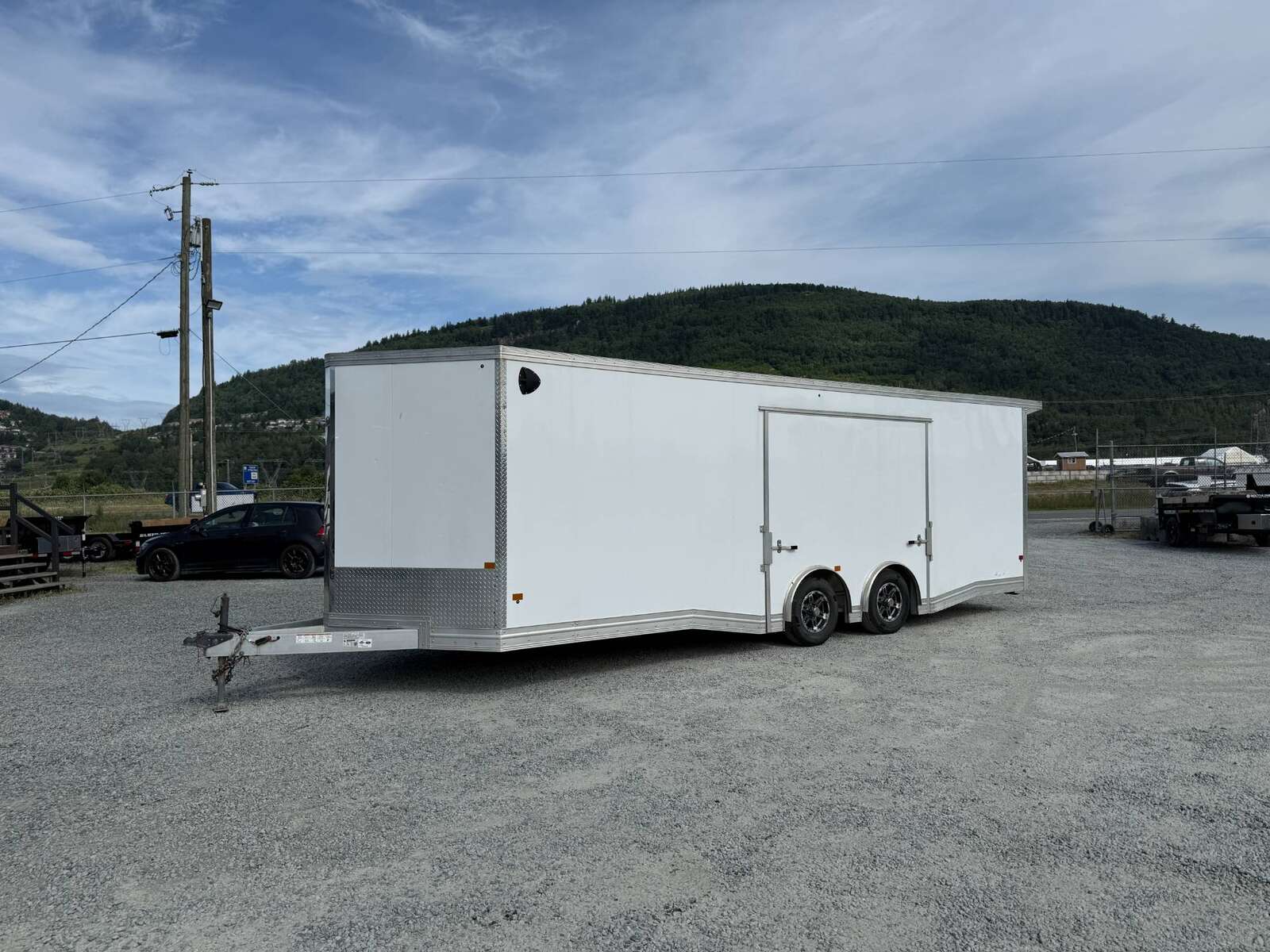 Photo of Pre Owned Used 2022 Alcom Stealth 8.5x24 V Nose Enclosed Cargo Car Hauler Trailer w/ Ramp Door & Elite Side Escape Door & Extended Rear Loading Ramps