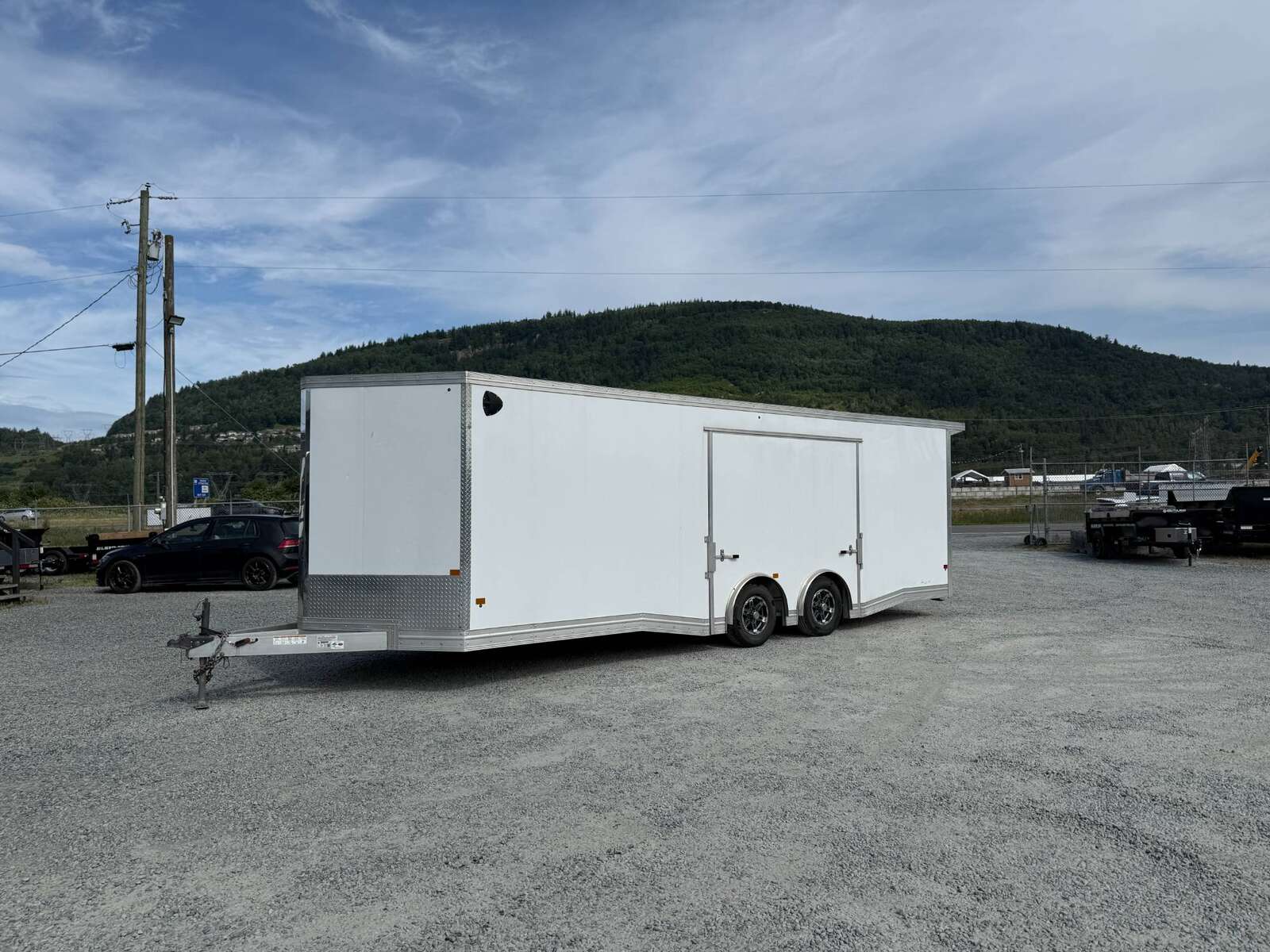 Photo of Pre Owned Used 2022 Alcom Stealth 8.5x24 V Nose Enclosed Cargo Car Hauler Trailer w/ Ramp Door & Elite Side Escape Door & Extended Rear Loading Ramps
