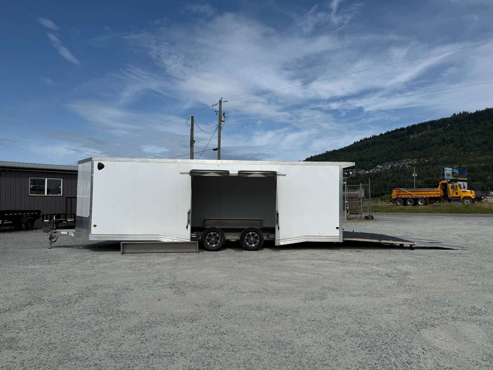 Photo of Pre Owned Used 2022 Alcom Stealth 8.5x24 V Nose Enclosed Cargo Car Hauler Trailer w/ Ramp Door & Elite Side Escape Door & Extended Rear Loading Ramps