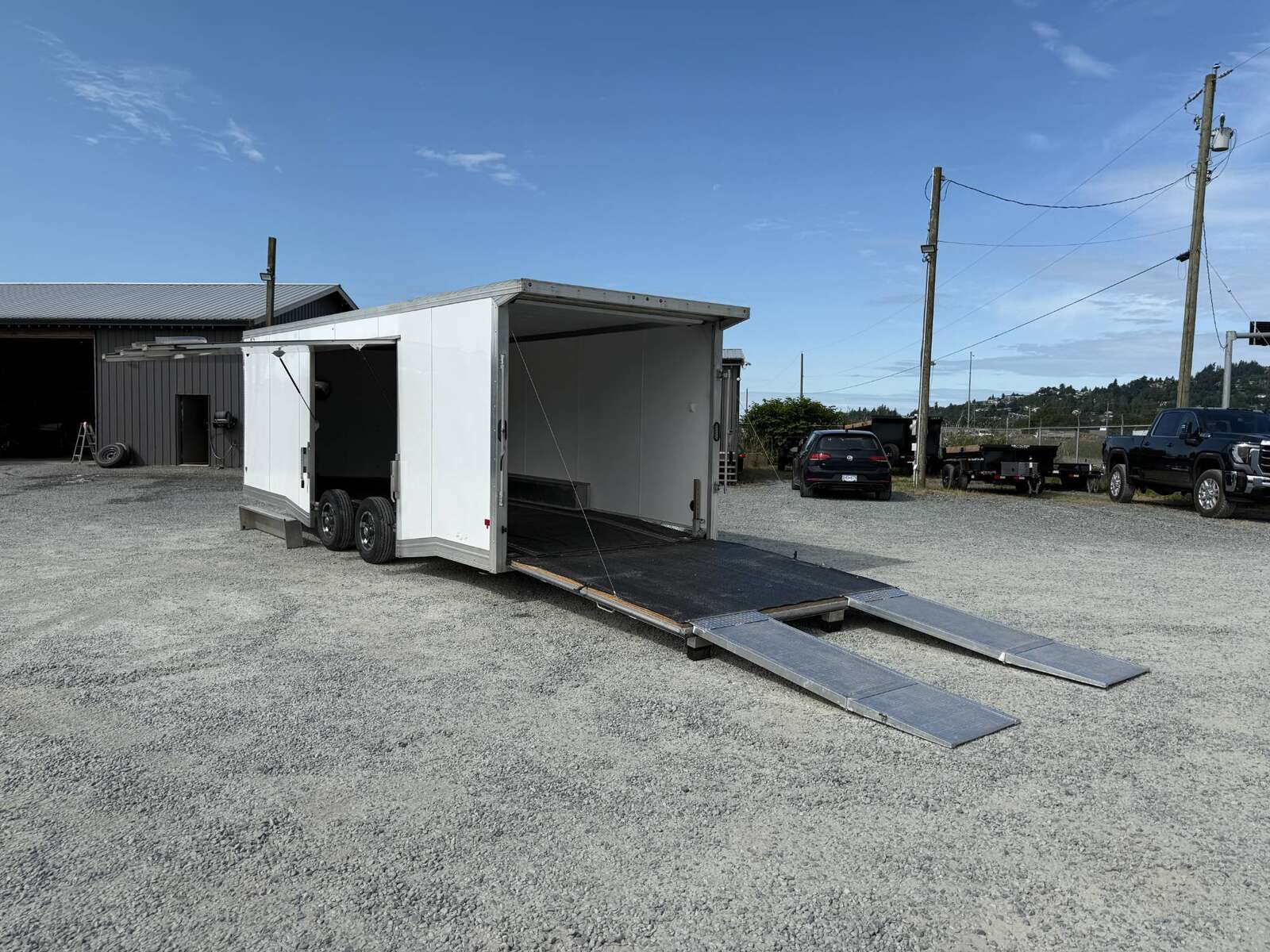 Photo of Pre Owned Used 2022 Alcom Stealth 8.5x24 V Nose Enclosed Cargo Car Hauler Trailer w/ Ramp Door & Elite Side Escape Door & Extended Rear Loading Ramps
