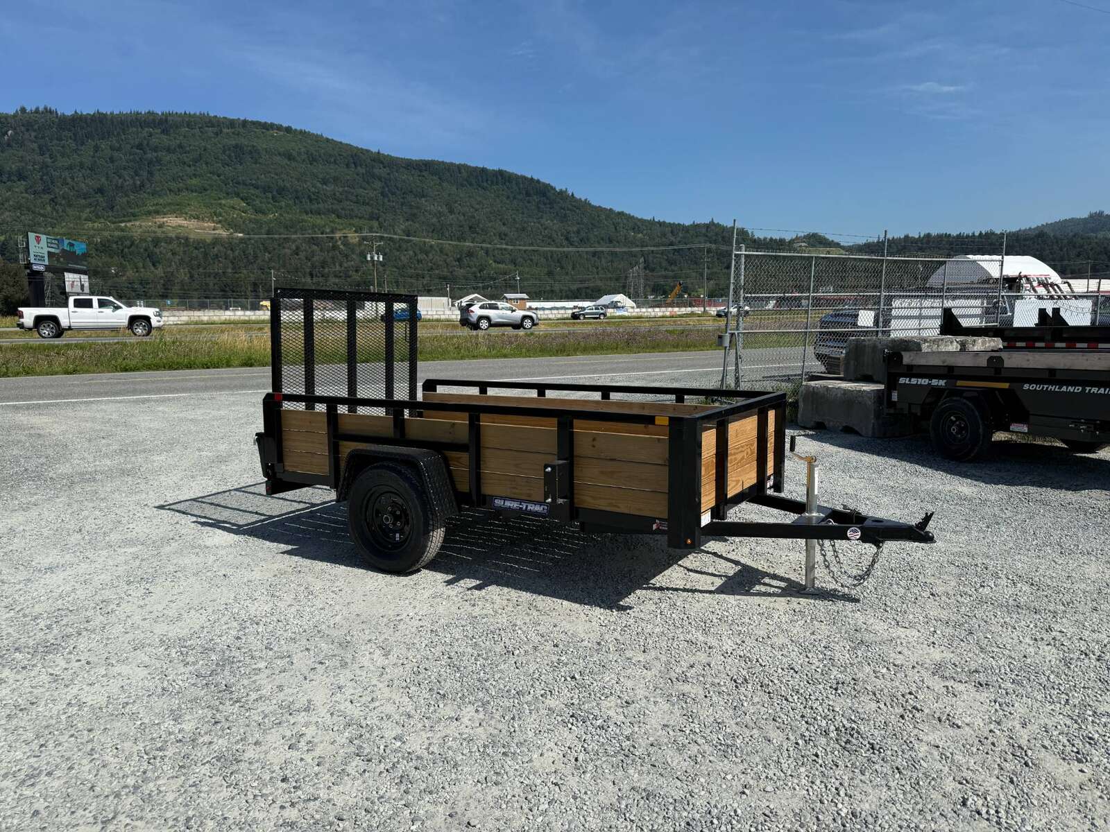 Photo of 2025 Suretrac 5x10 Landscape Utility Trailer 3 Board High Side w/ Ramp Gate 2990lb GVW