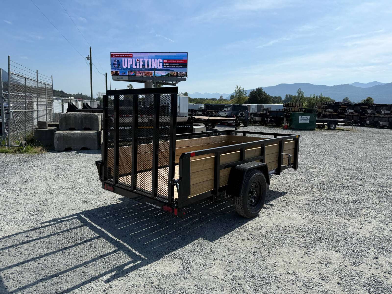 Photo of 2025 Suretrac 5x10 Landscape Utility Trailer 3 Board High Side w/ Ramp Gate 2990lb GVW