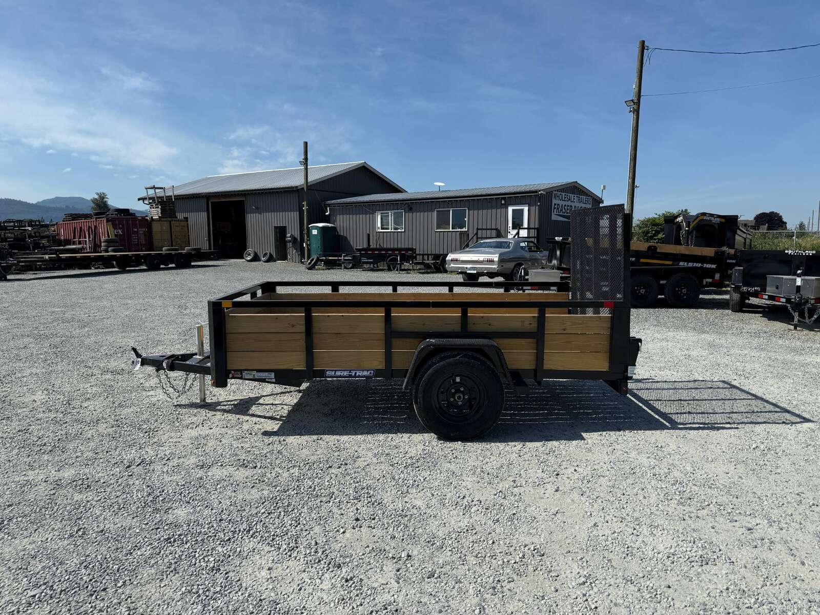 Photo of 2025 Suretrac 5x10 Landscape Utility Trailer 3 Board High Side w/ Ramp Gate 2990lb GVW