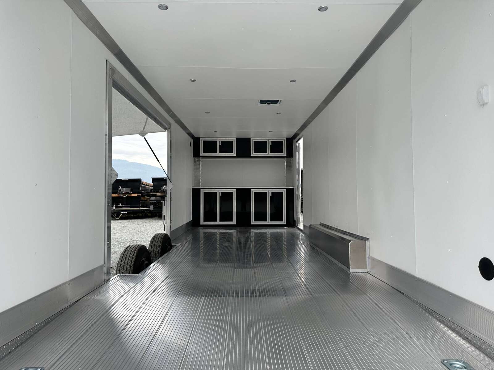Photo of 2026 ALCOM ALUMINUM 8.5x24 CAR TRAILER 9900lb GVW SILVER LARGE ESCAPE SIDE DOOR CARGO ENCLOSED