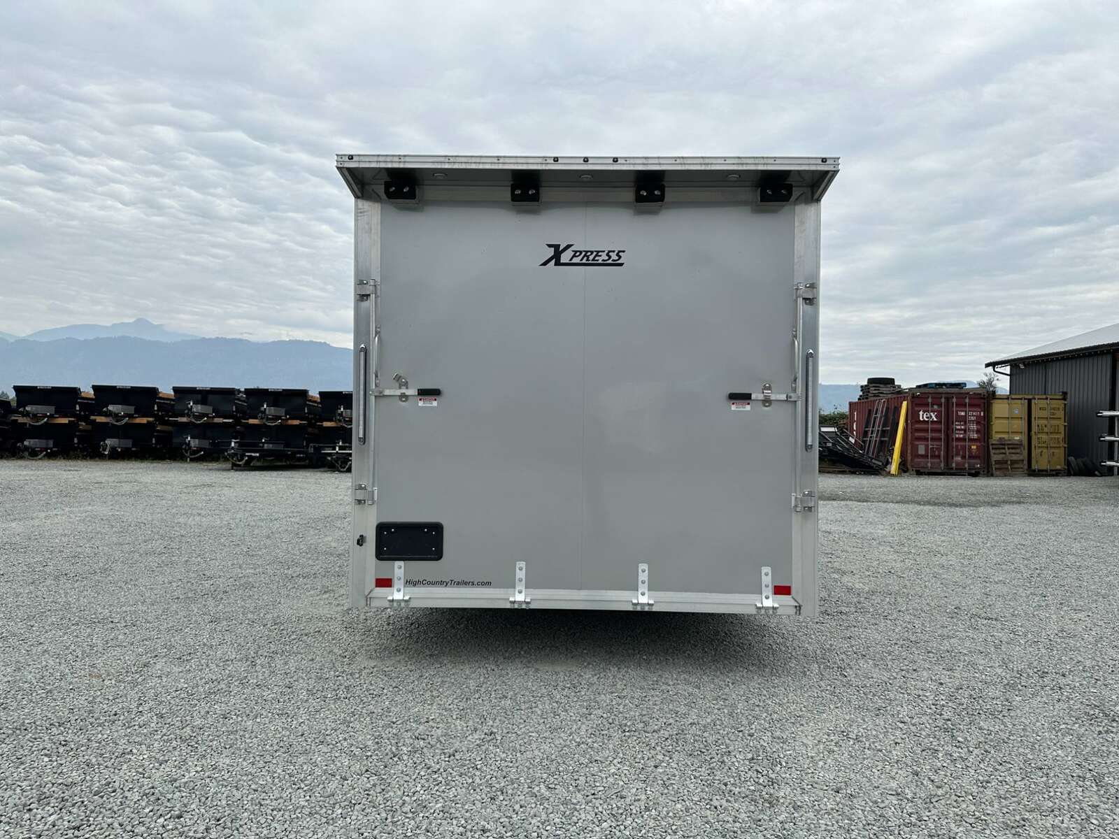 Photo of 2026 ALCOM ALUMINUM 8.5x24 CAR TRAILER 9900lb GVW SILVER LARGE ESCAPE SIDE DOOR CARGO ENCLOSED