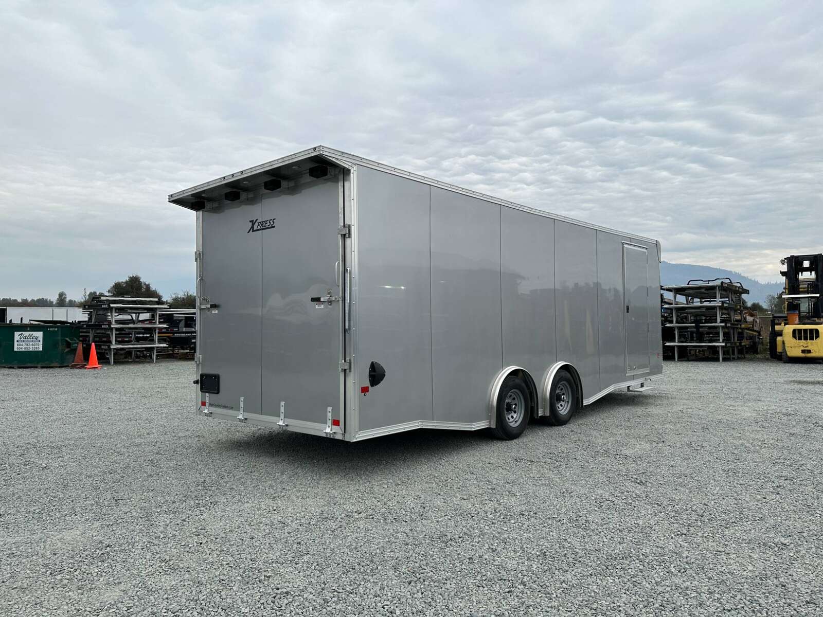 Photo of 2026 ALCOM ALUMINUM 8.5x24 CAR TRAILER 9900lb GVW SILVER LARGE ESCAPE SIDE DOOR CARGO ENCLOSED
