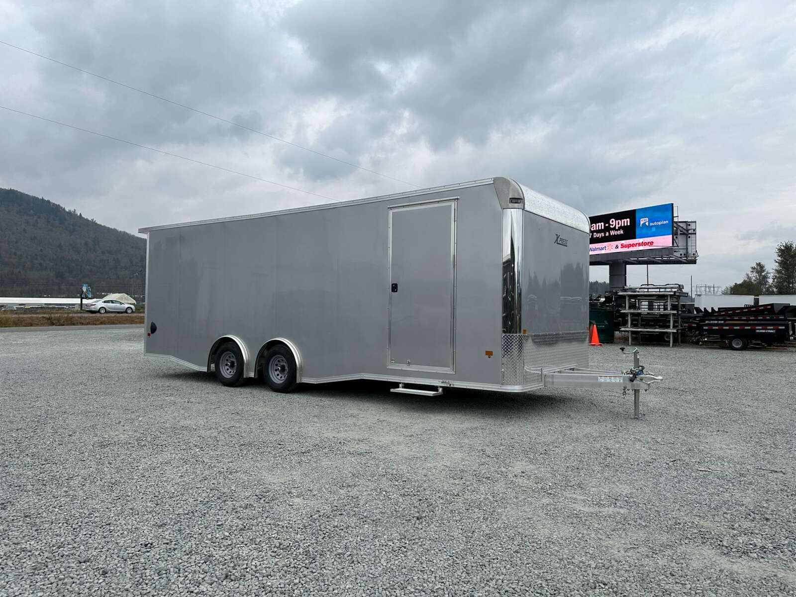 Photo of 2026 ALCOM ALUMINUM 8.5x24 CAR TRAILER 9900lb GVW SILVER LARGE ESCAPE SIDE DOOR CARGO ENCLOSED