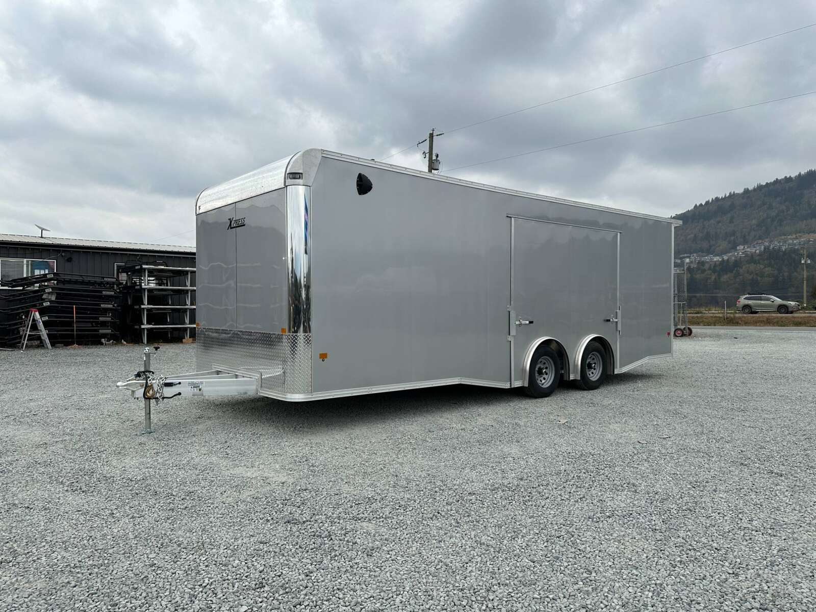 Photo of 2026 ALCOM ALUMINUM 8.5x24 CAR TRAILER 9900lb GVW SILVER LARGE ESCAPE SIDE DOOR CARGO ENCLOSED