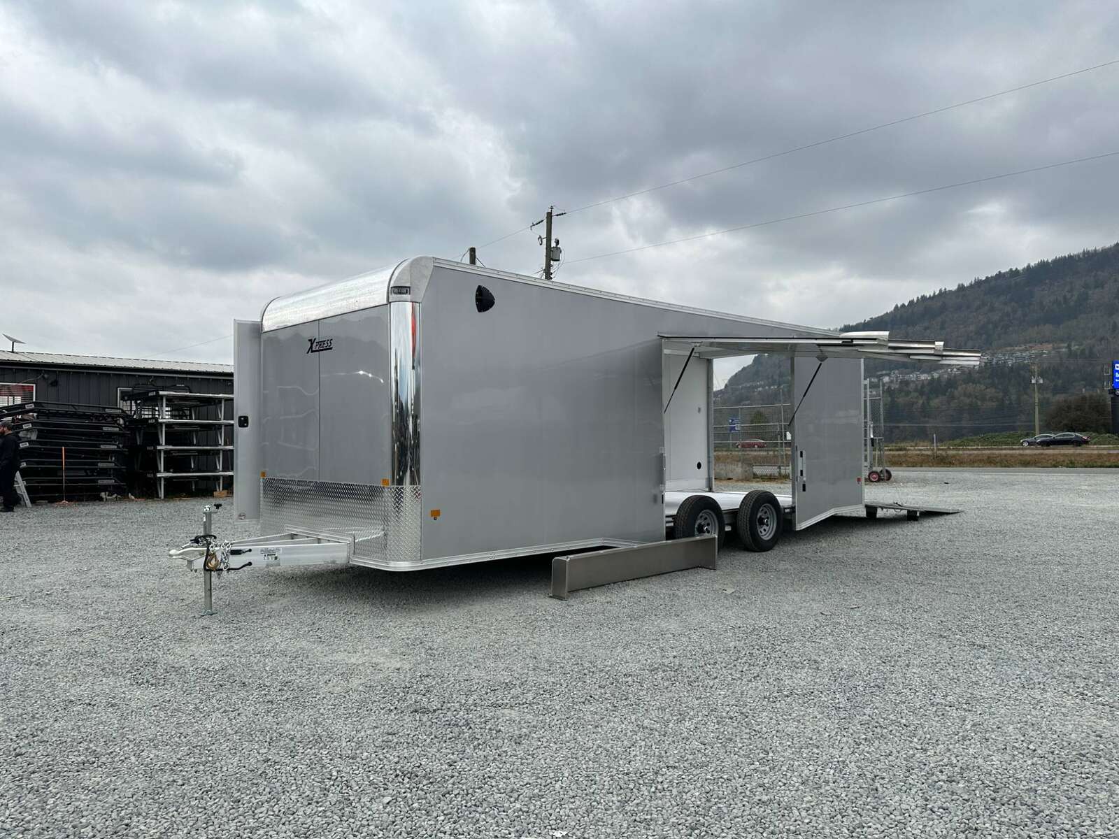 Photo of 2026 ALCOM ALUMINUM 8.5x24 CAR TRAILER 9900lb GVW SILVER LARGE ESCAPE SIDE DOOR CARGO ENCLOSED