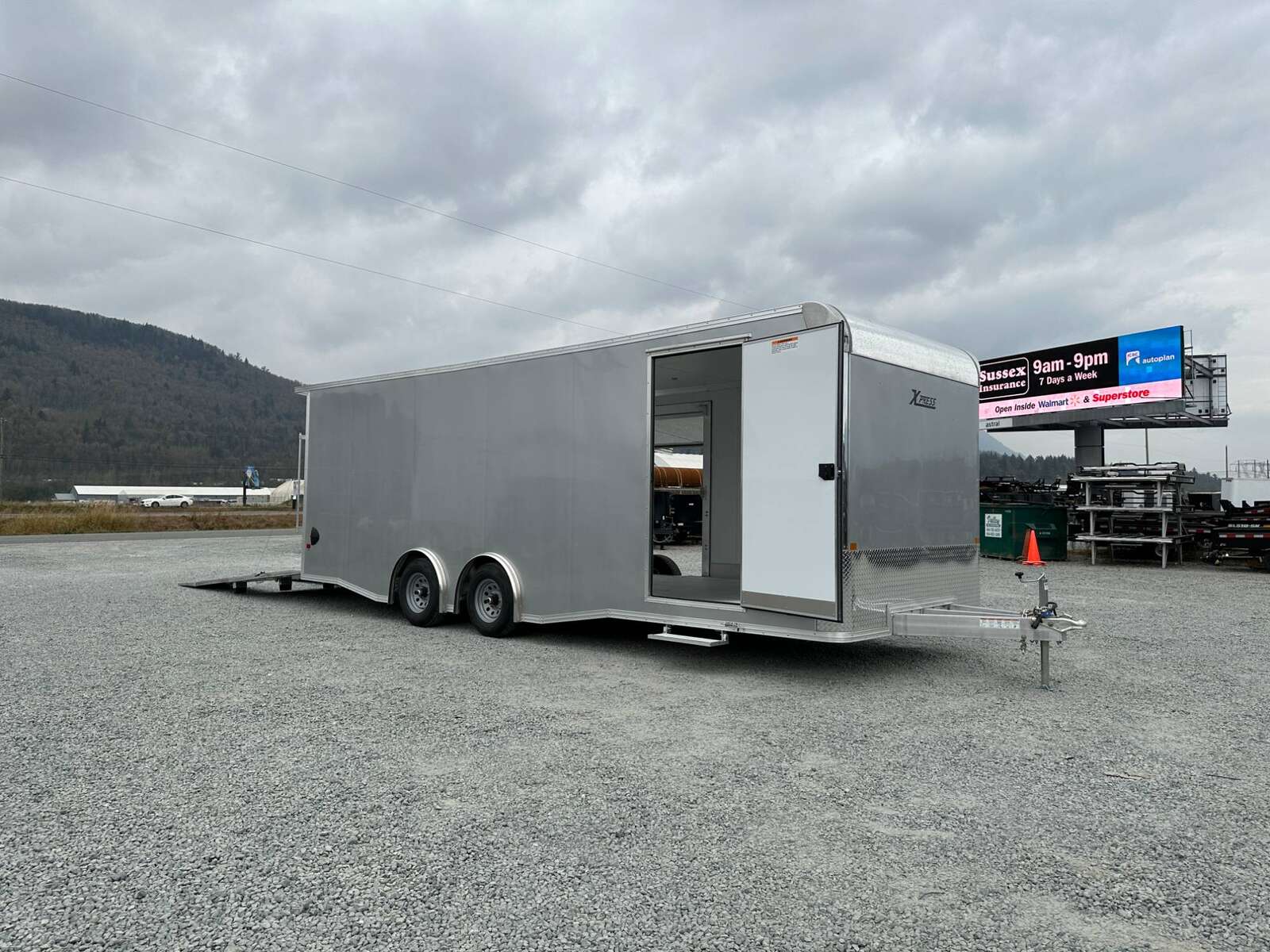 Photo of 2026 ALCOM ALUMINUM 8.5x24 CAR TRAILER 9900lb GVW SILVER LARGE ESCAPE SIDE DOOR CARGO ENCLOSED