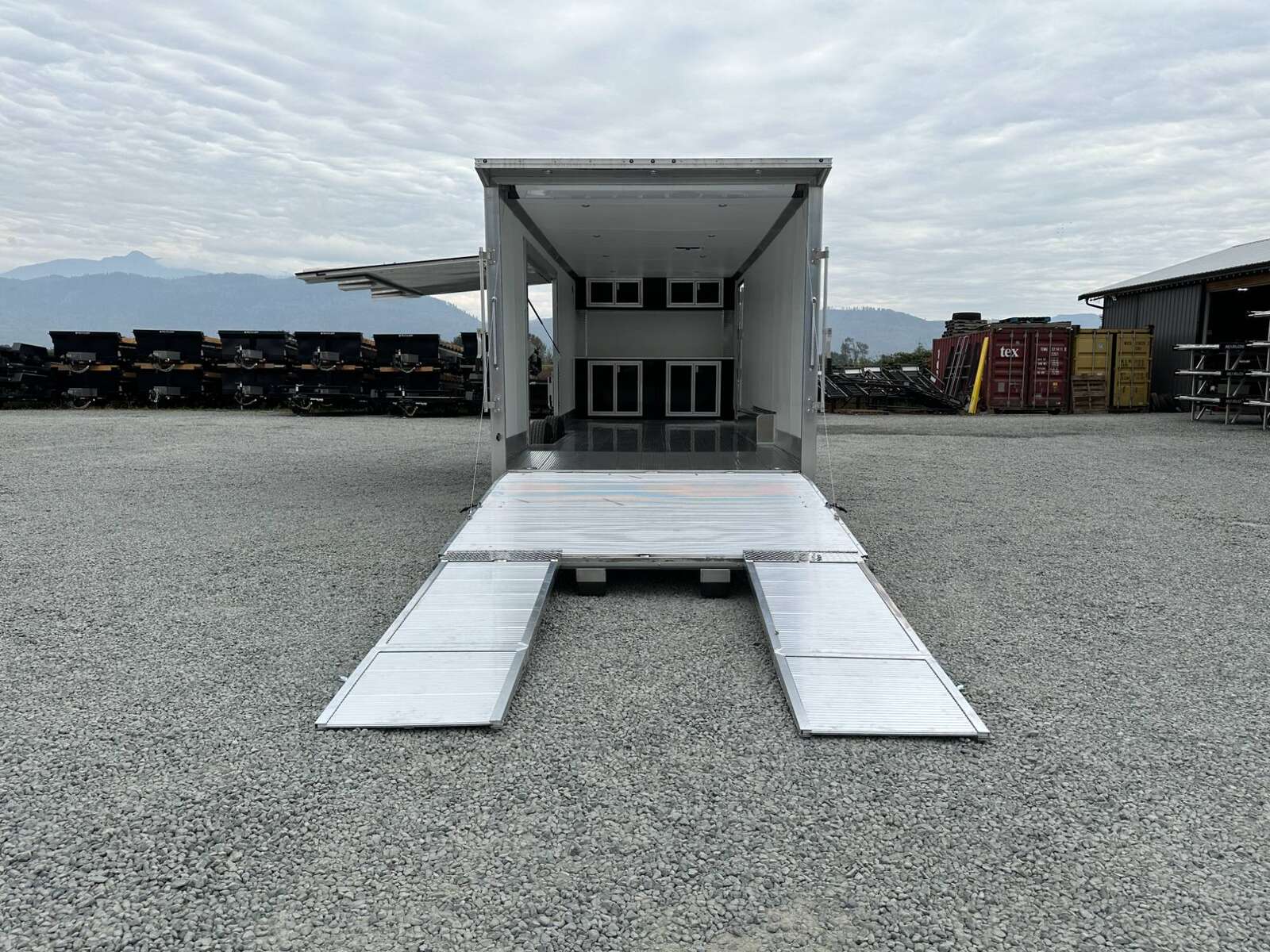 Photo of 2026 ALCOM ALUMINUM 8.5x24 CAR TRAILER 9900lb GVW SILVER LARGE ESCAPE SIDE DOOR CARGO ENCLOSED