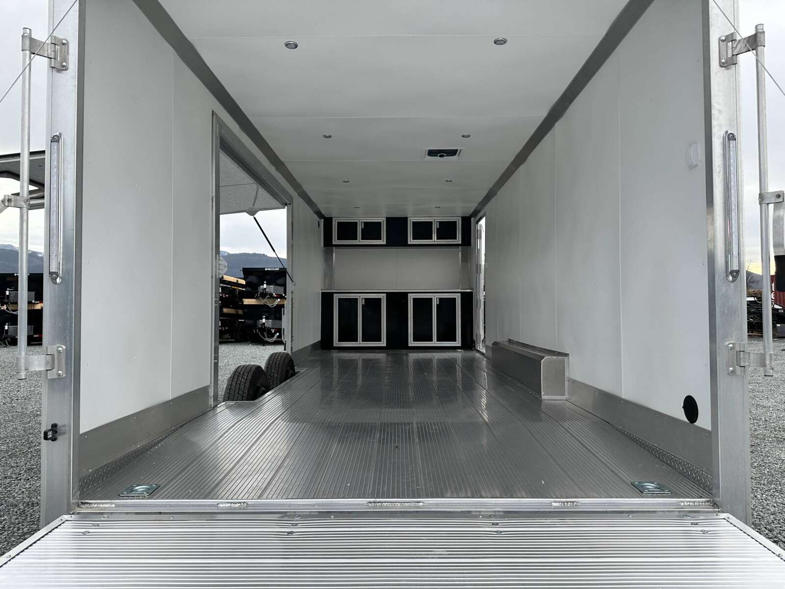 Photo of 2026 ALCOM ALUMINUM 8.5x24 CAR TRAILER 9900lb GVW WHITE LARGE ESCAPE SIDE DOOR CARGO ENCLOSED