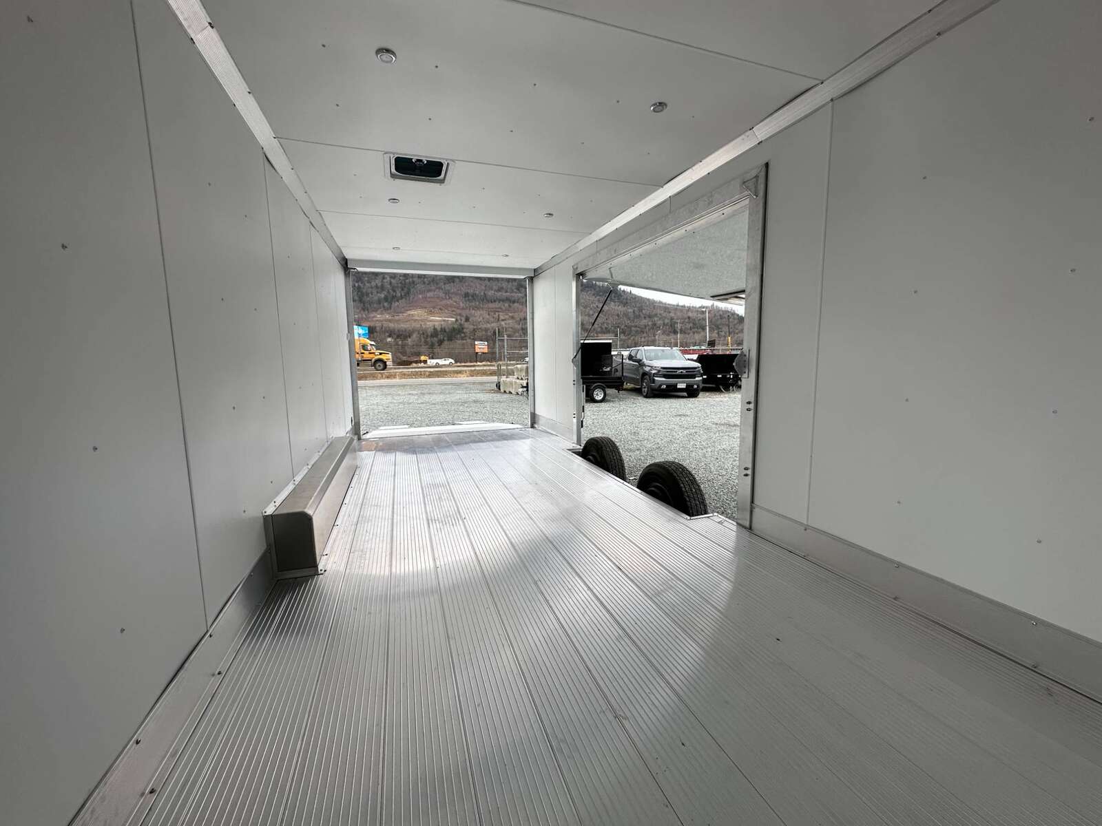 Photo of 2026 ALCOM ALUMINUM 8.5x24 CAR TRAILER 9900lb GVW WHITE LARGE ESCAPE SIDE DOOR CARGO ENCLOSED