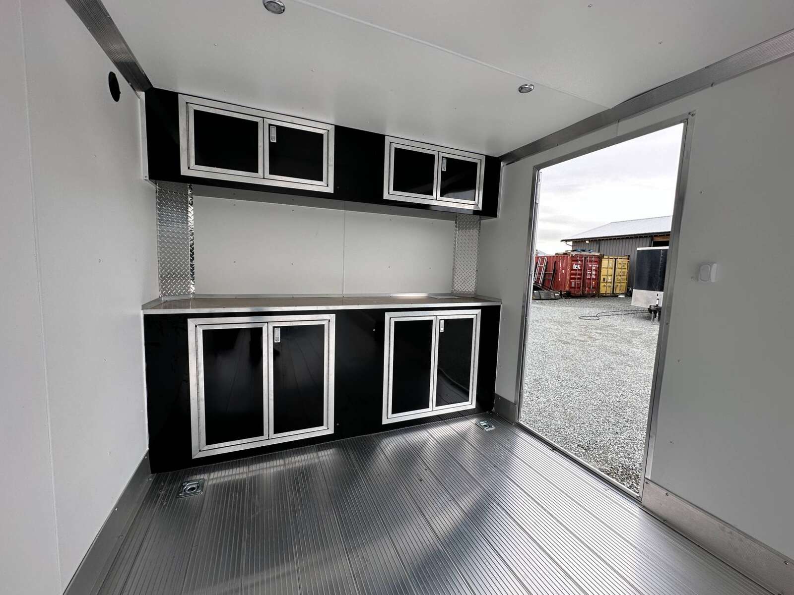 Photo of 2026 ALCOM ALUMINUM 8.5x24 CAR TRAILER 9900lb GVW WHITE LARGE ESCAPE SIDE DOOR CARGO ENCLOSED