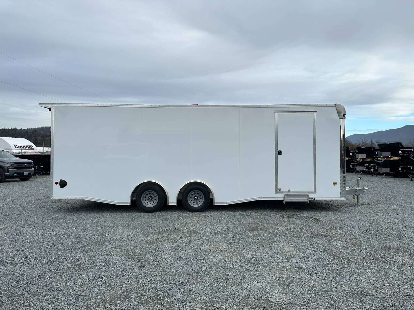 Photo of 2026 ALCOM ALUMINUM 8.5x24 CAR TRAILER 9900lb GVW WHITE LARGE ESCAPE SIDE DOOR CARGO ENCLOSED