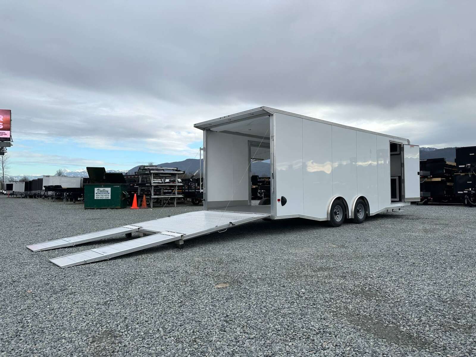 Photo of 2026 ALCOM ALUMINUM 8.5x24 CAR TRAILER 9900lb GVW WHITE LARGE ESCAPE SIDE DOOR CARGO ENCLOSED