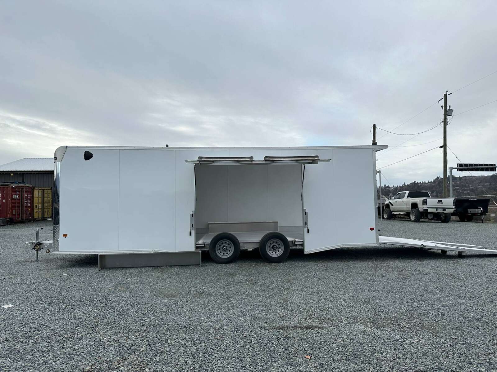 Photo of 2026 ALCOM ALUMINUM 8.5x24 CAR TRAILER 9900lb GVW WHITE LARGE ESCAPE SIDE DOOR CARGO ENCLOSED