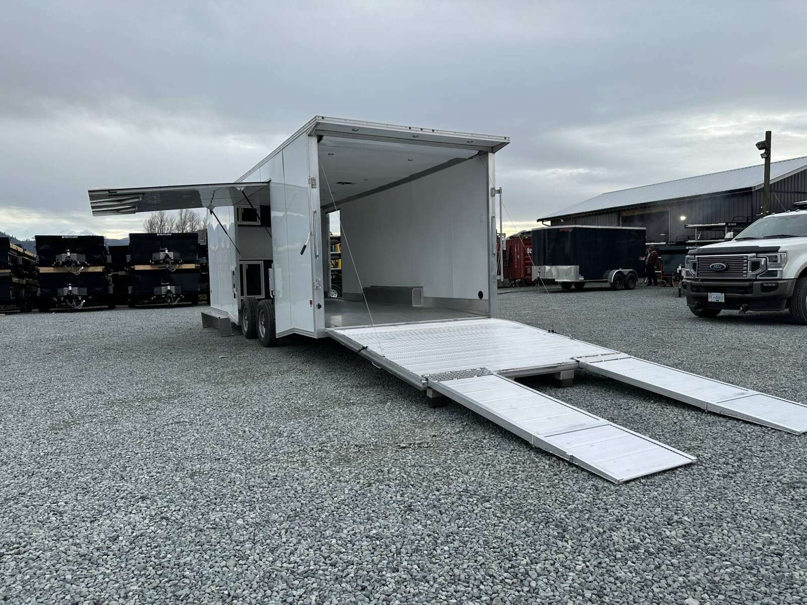 Photo of 2026 ALCOM ALUMINUM 8.5x24 CAR TRAILER 9900lb GVW WHITE LARGE ESCAPE SIDE DOOR CARGO ENCLOSED