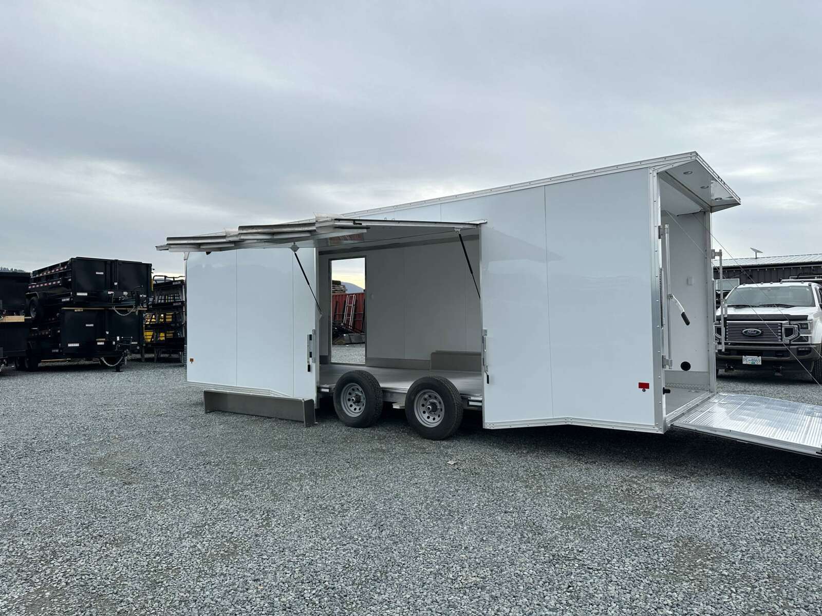 Photo of 2026 ALCOM ALUMINUM 8.5x24 CAR TRAILER 9900lb GVW WHITE LARGE ESCAPE SIDE DOOR CARGO ENCLOSED