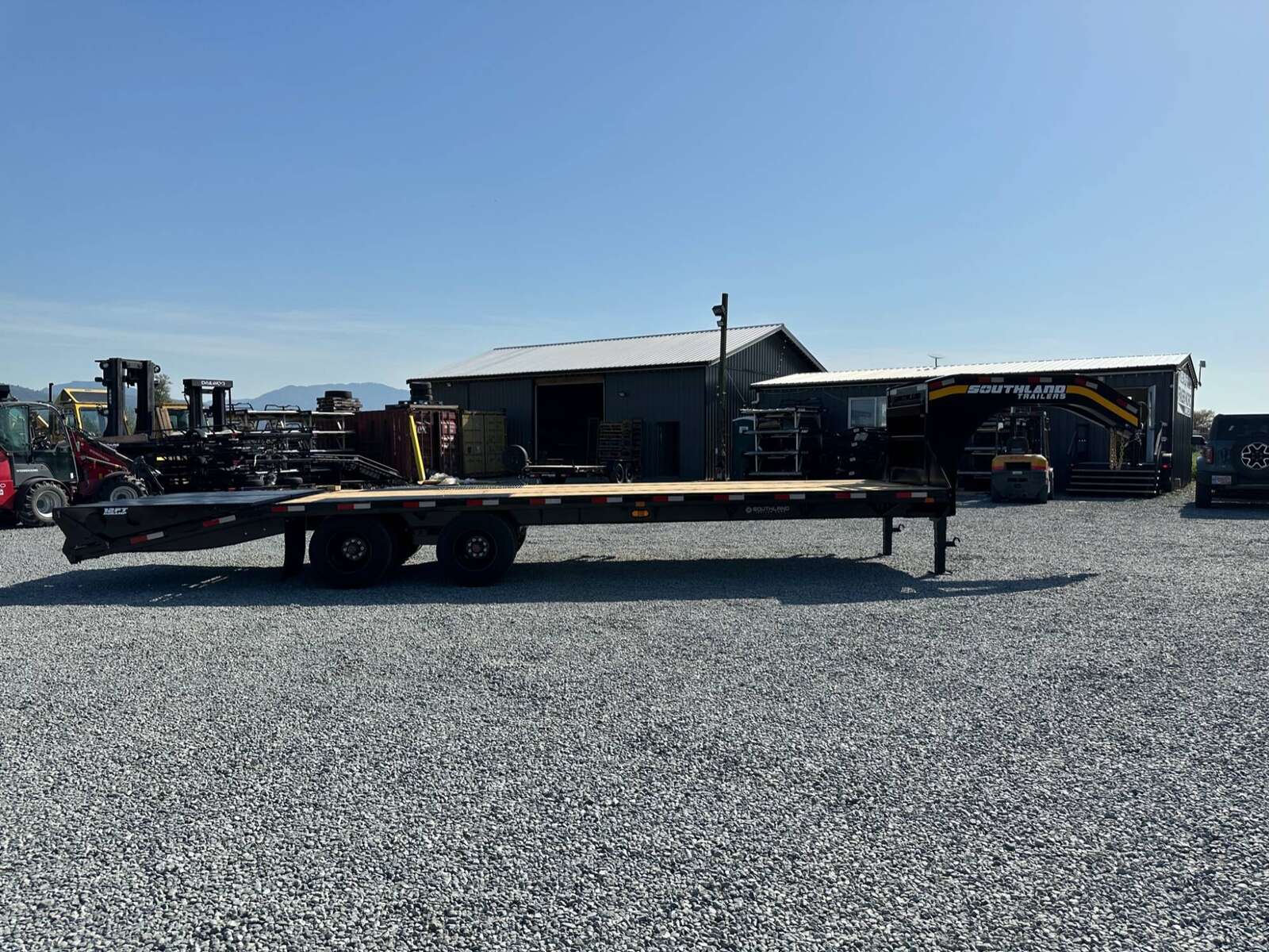 Photo of 2026 Southland 24+6 Gooseneck Equipment Flat Bed Trailer Deck Over 29,000lb GVW w/ Flip up ramps