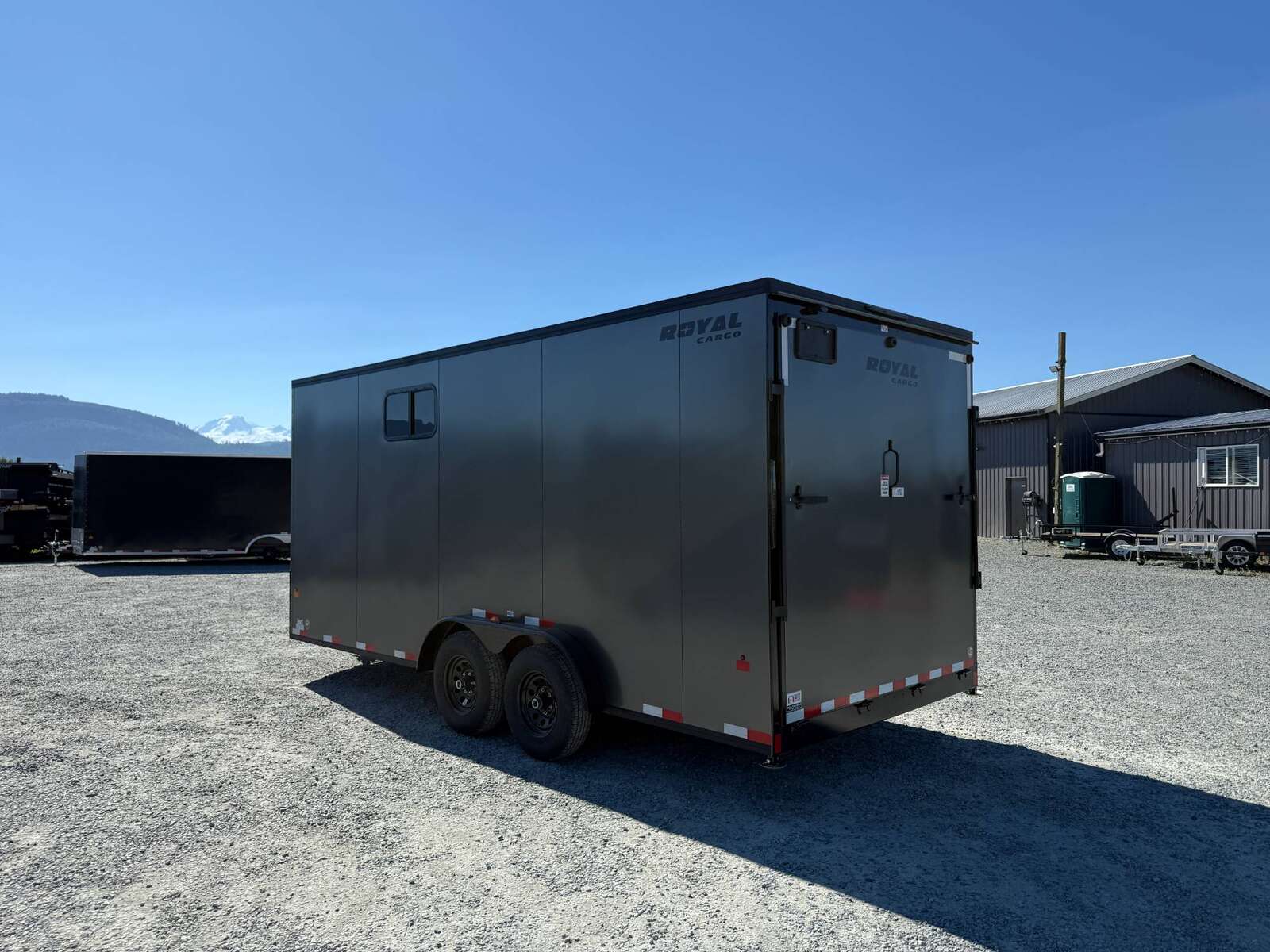 Photo of 2026 Royal 7.5x18 Cargo Enclosed Trailer Blackout Package w/ Side Windows Heavy Duty 11400lb GVW w/ Ramp Door Charcoal Grey