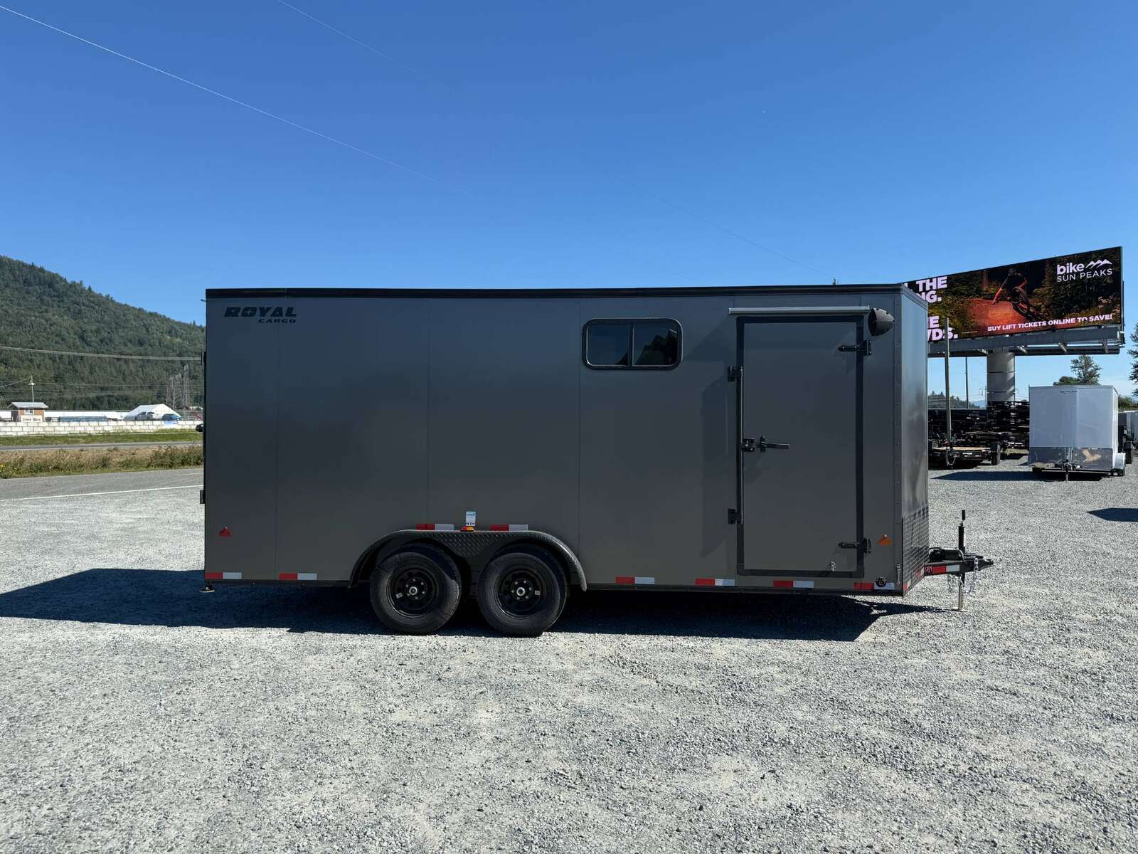 Photo of 2026 Royal 7.5x18 Cargo Enclosed Trailer Blackout Package w/ Side Windows Heavy Duty 11400lb GVW w/ Ramp Door Charcoal Grey
