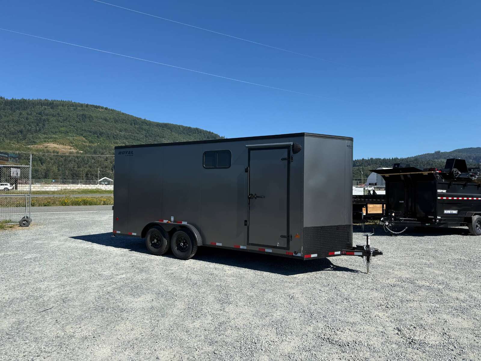 Photo of 2026 Royal 7.5x18 Cargo Enclosed Trailer Blackout Package w/ Side Windows Heavy Duty 11400lb GVW w/ Ramp Door Charcoal Grey