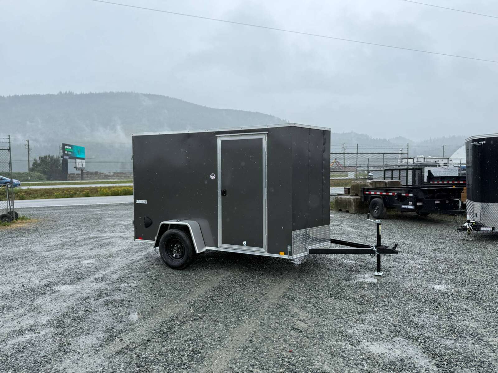 Photo of 2026 Mirage XE 6x10 Enclosed Cargo Trailer V Nose Barn Doors Charcoal Grey Standard Height 2990lb GVW