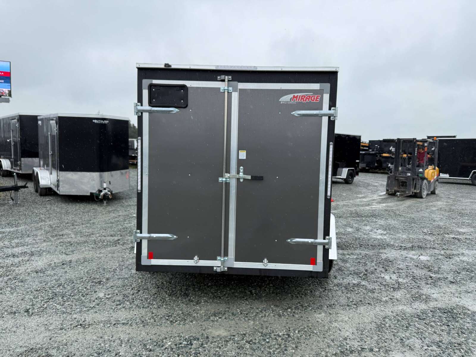 Photo of 2026 Mirage XE 6x10 Enclosed Cargo Trailer V Nose Barn Doors Charcoal Grey Standard Height 2990lb GVW