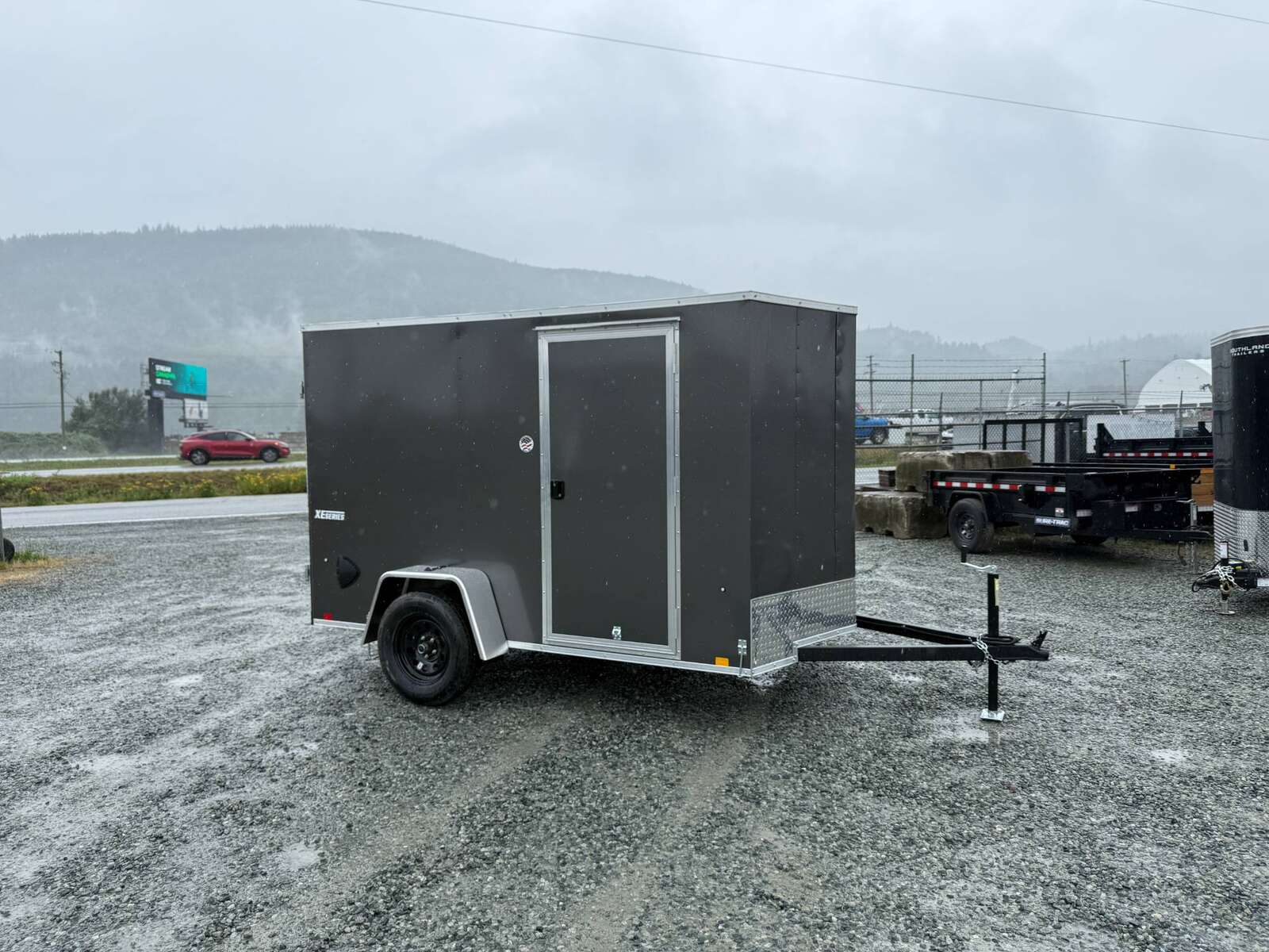 Photo of 2026 Mirage XE 6x10 Enclosed Cargo Trailer V Nose Barn Doors Charcoal Grey Standard Height 2990lb GVW