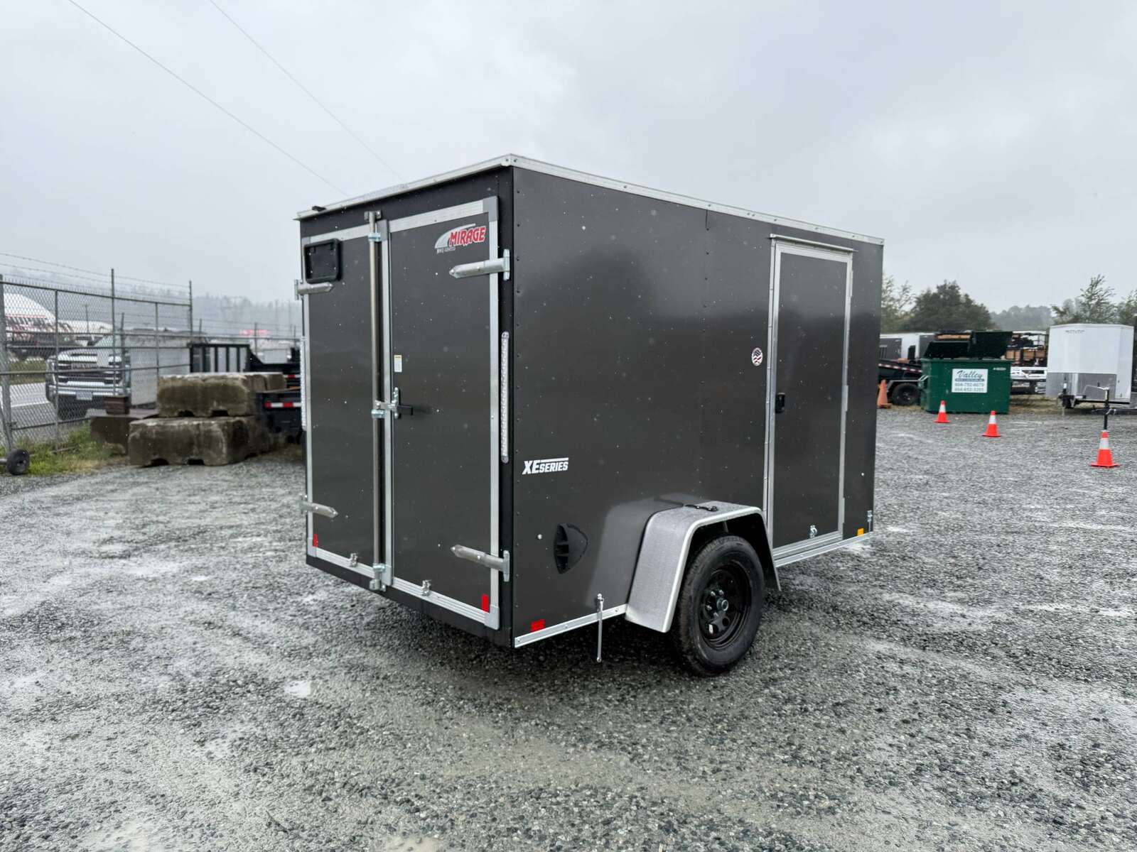 Photo of 2026 Mirage XE 6x10 Enclosed Cargo Trailer V Nose Barn Doors Charcoal Grey Standard Height 2990lb GVW