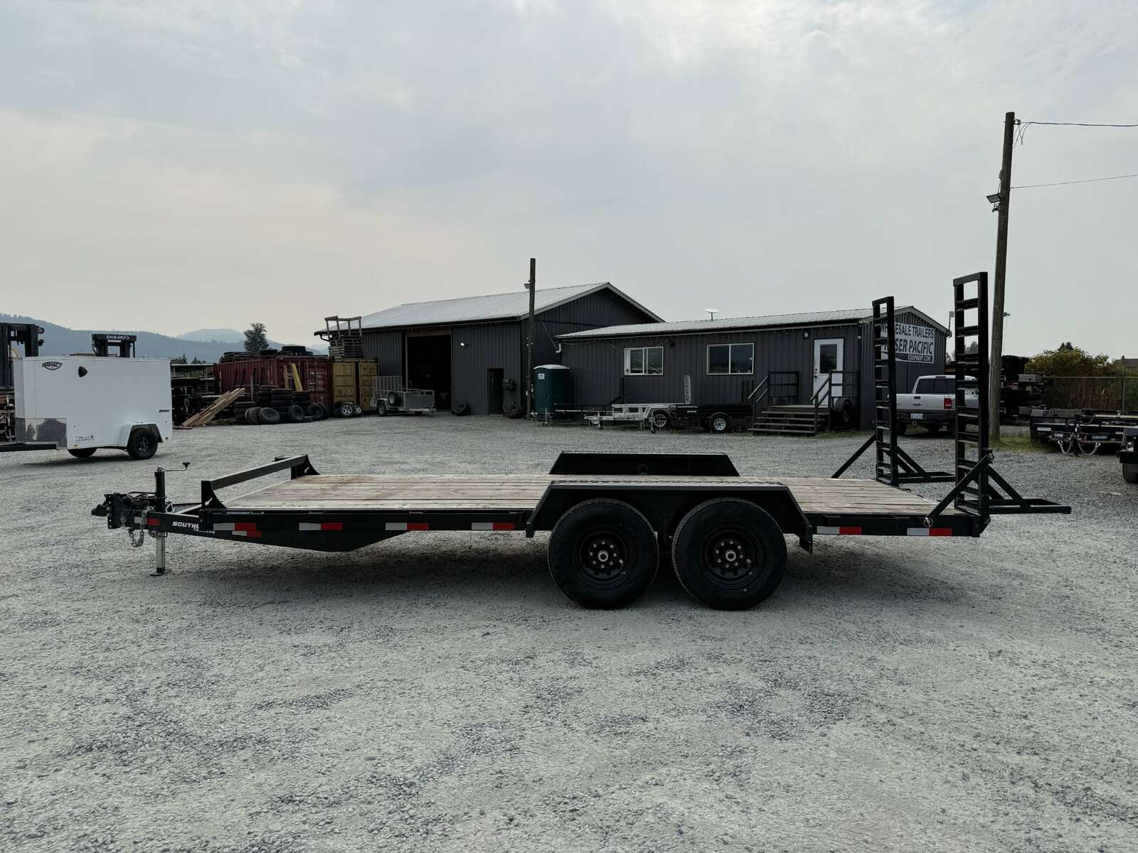 Photo of Used Pre Owned 2024 Southland 7X18 15,400LB GVW Equipment Flat Deck Trailer w/ Stand Up Ramps