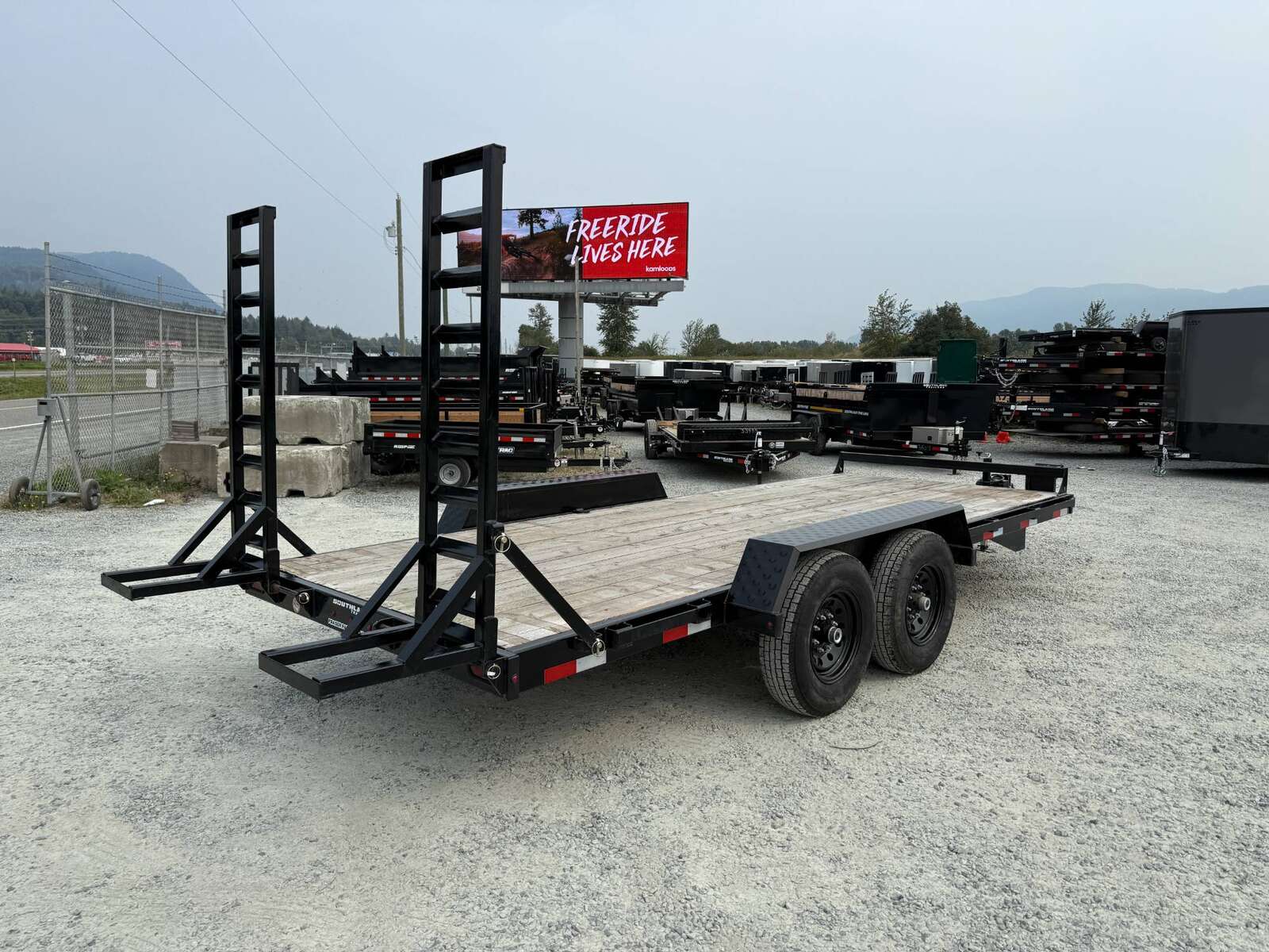 Photo of Used Pre Owned 2024 Southland 7X18 15,400LB GVW Equipment Flat Deck Trailer w/ Stand Up Ramps
