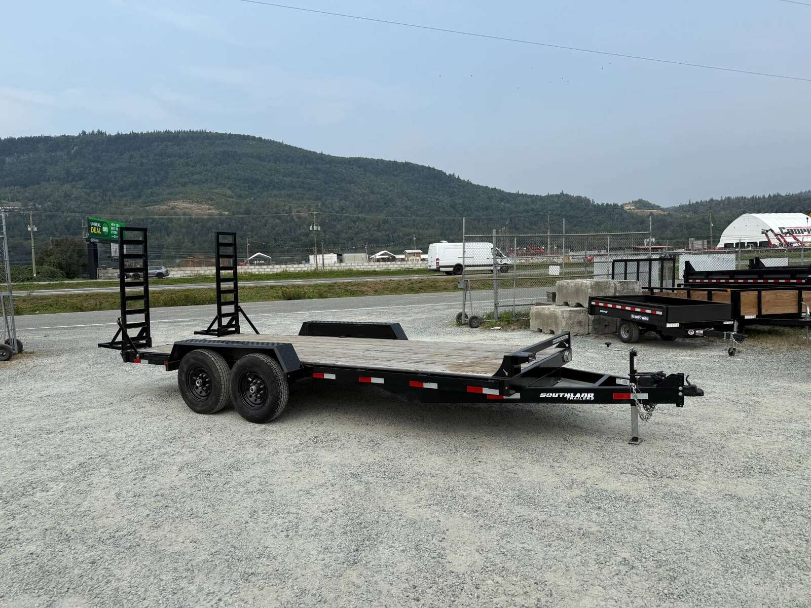 Photo of Used Pre Owned 2024 Southland 7X18 15,400LB GVW Equipment Flat Deck Trailer w/ Stand Up Ramps
