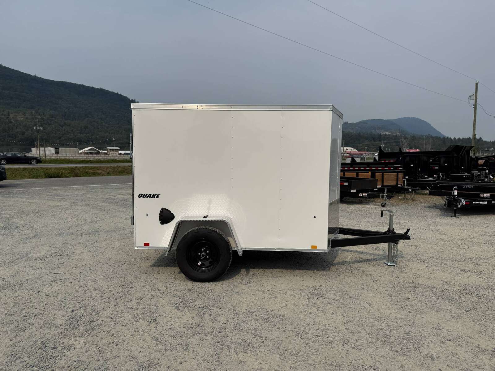 Photo of 2026 Impact 5x8 Quake V Nose Cargo Enclosed Trailer Ramp Door White 2990lb GVW