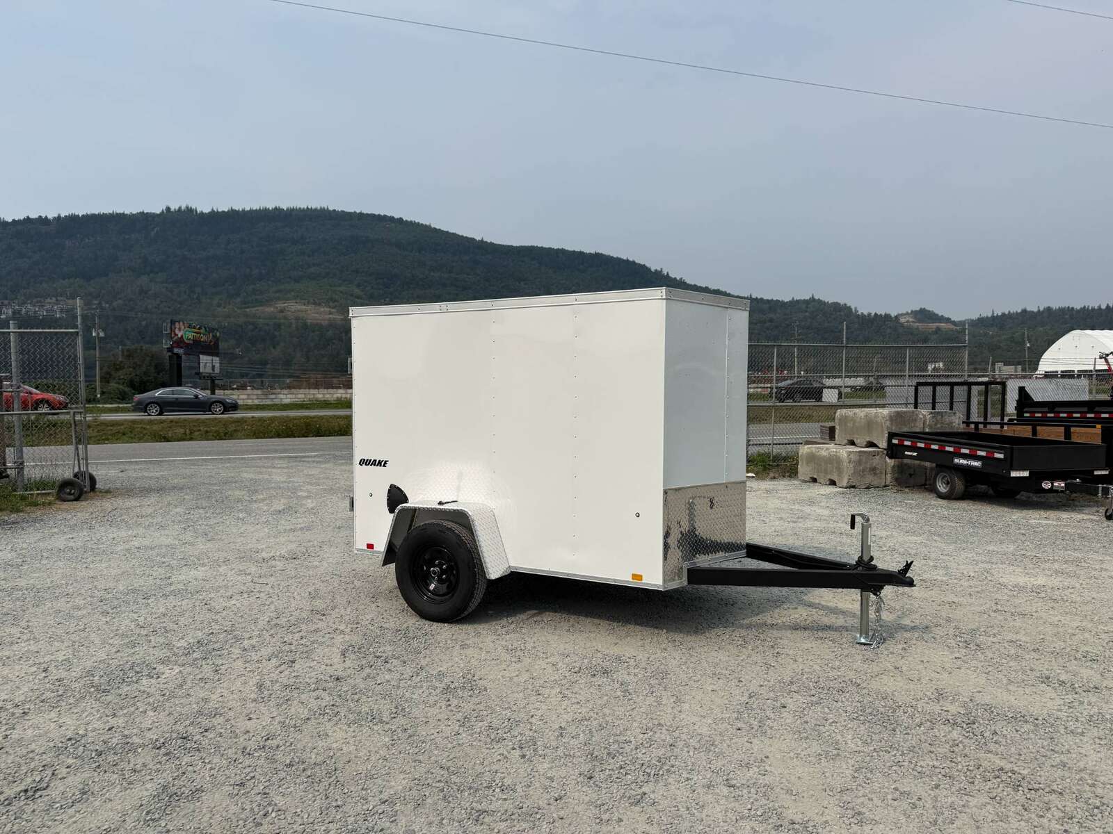 Photo of 2026 Impact 5x8 Quake V Nose Cargo Enclosed Trailer Ramp Door White 2990lb GVW