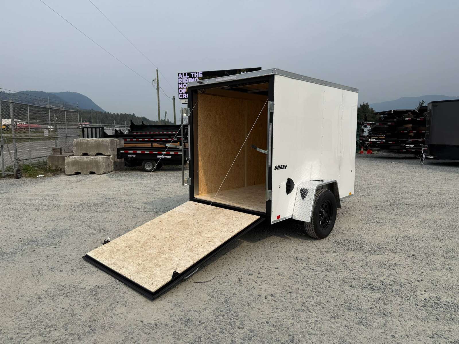 Photo of 2026 Impact 5x8 Quake V Nose Cargo Enclosed Trailer Ramp Door White 2990lb GVW