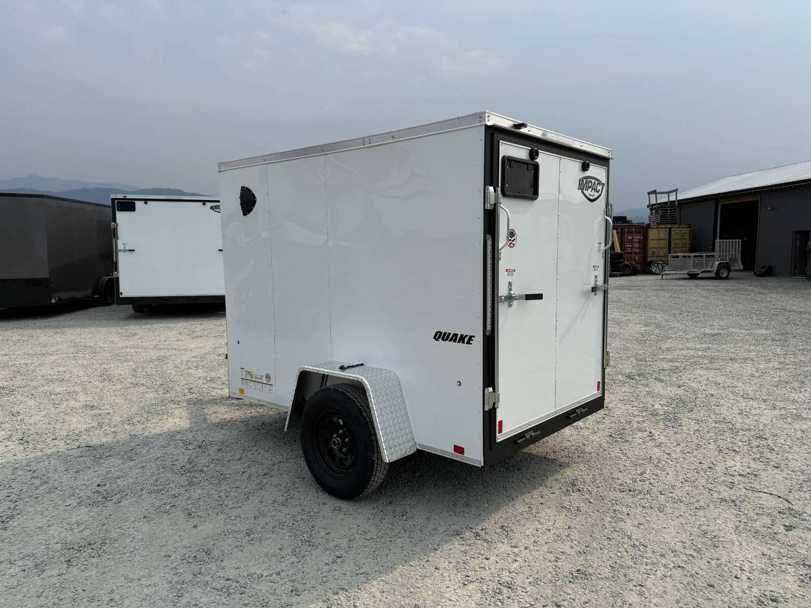 Photo of 2026 Impact 5x8 Quake V Nose Cargo Enclosed Trailer Ramp Door White 2990lb GVW