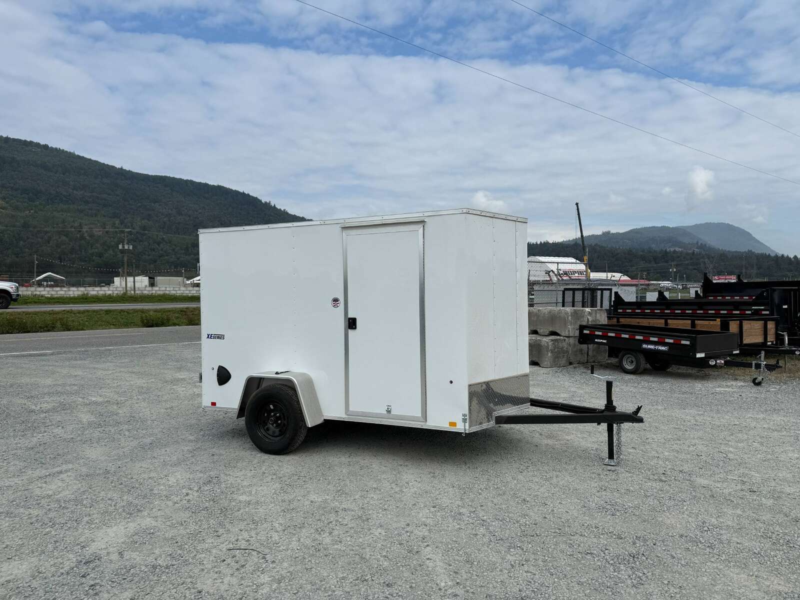 Photo of 2026 Mirage XE 6x10 Enclosed Cargo Trailer V Nose Barn Doors White Standard Height 2990lb GVW