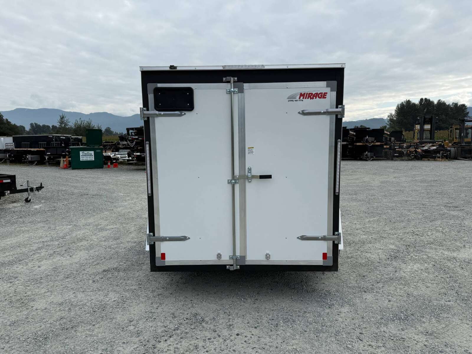 Photo of 2026 Mirage XE 6x10 Enclosed Cargo Trailer V Nose Barn Doors White Standard Height 2990lb GVW