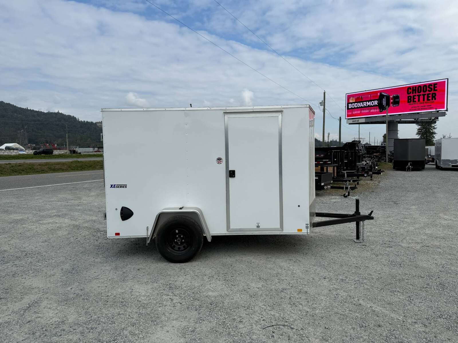 Photo of 2026 Mirage XE 6x10 Enclosed Cargo Trailer V Nose Barn Doors White Standard Height 2990lb GVW