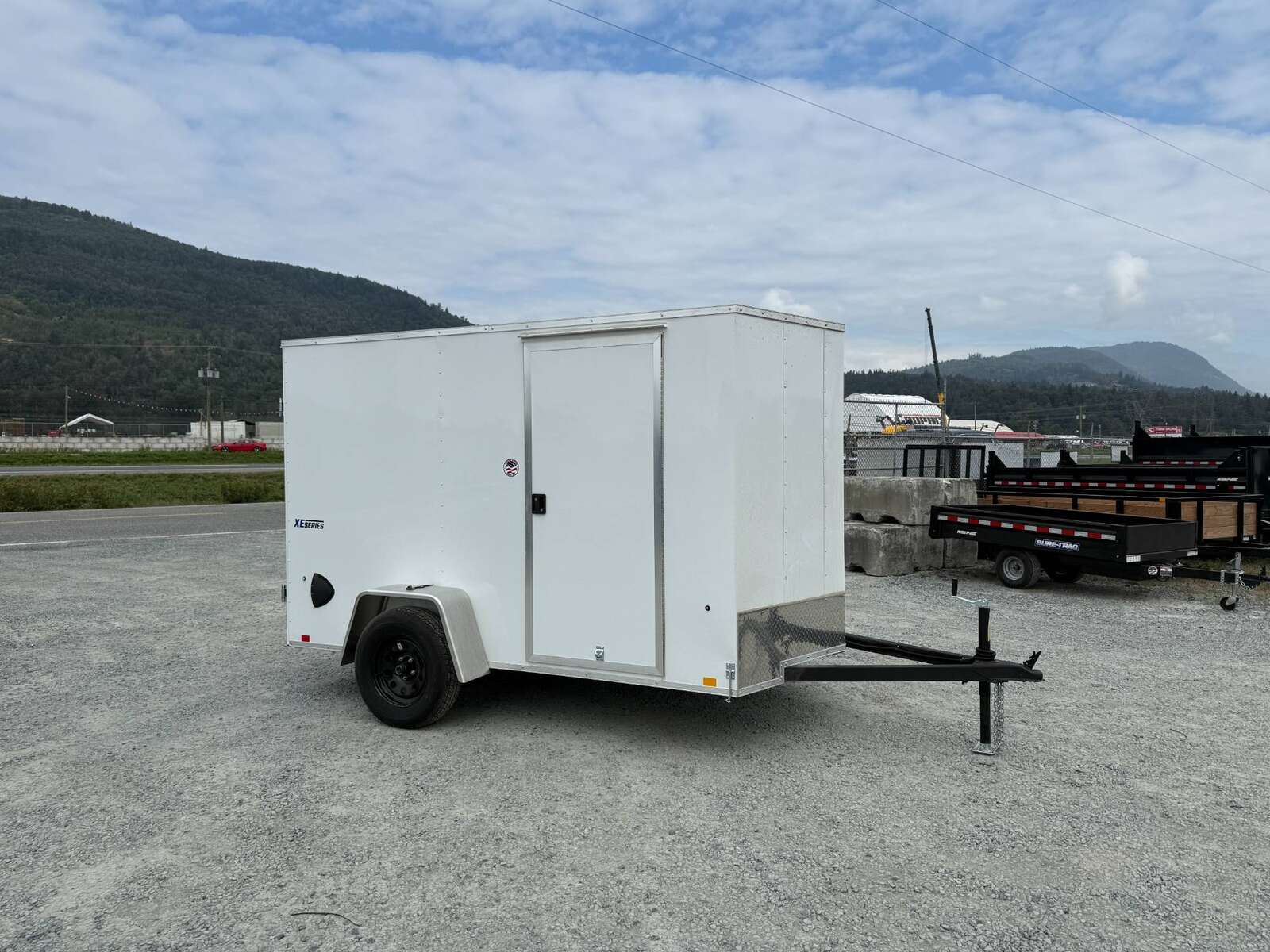 Photo of 2026 Mirage XE 6x10 Enclosed Cargo Trailer V Nose Barn Doors White Standard Height 2990lb GVW