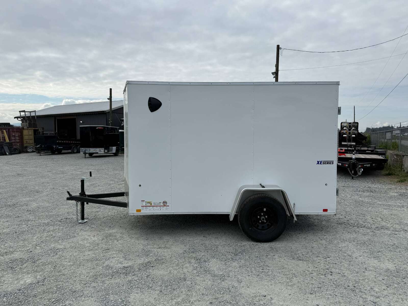 Photo of 2026 Mirage XE 6x10 Enclosed Cargo Trailer V Nose Barn Doors White Standard Height 2990lb GVW