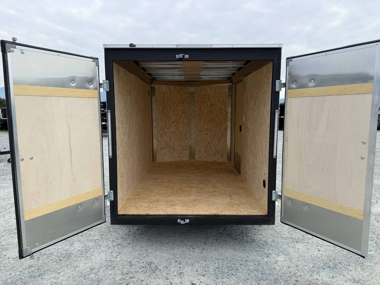 Photo of 2026 Mirage XE 6x10 Enclosed Cargo Trailer V Nose Barn Doors White Standard Height 2990lb GVW